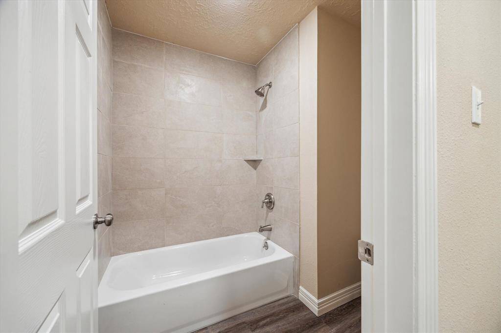 Modern shower and tub combination for versatile bathing options.