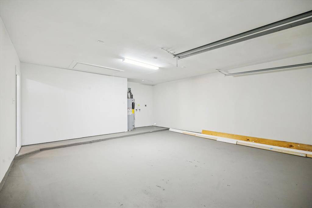 This garage features a freshly painted floor for a modern, polished look.