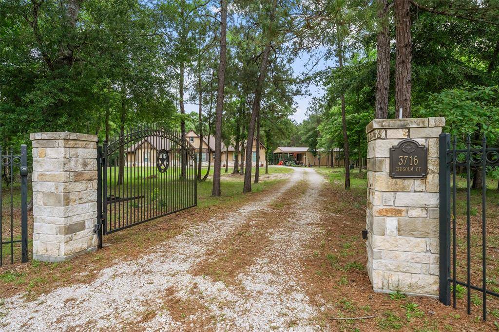 Welcome to 3716 Chisolm Court, a private, gated estate tucked beneath the trees and set back on 6 peaceful acres. From the moment you pass through the gate, you’ll feel the quiet charm and seclusion that make this property truly special.