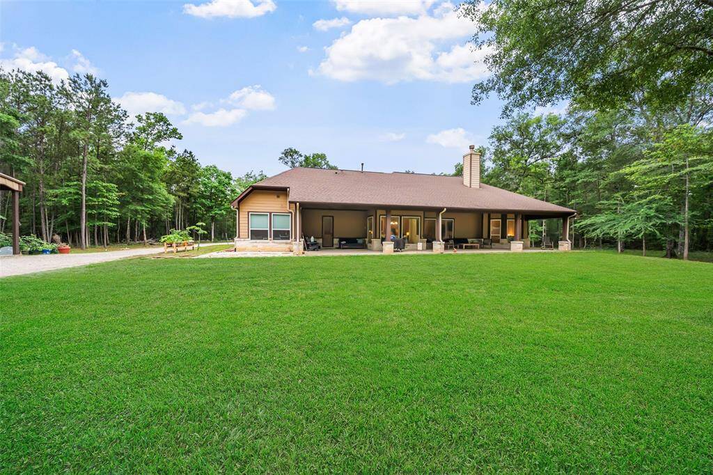 Surrounded by trees and open space, this sprawling backyard offers endless room to roam, play, or just soak in the quiet of country living. With a massive covered patio and room for future additions, it’s the perfect backdrop for all of your outdoor dreams.