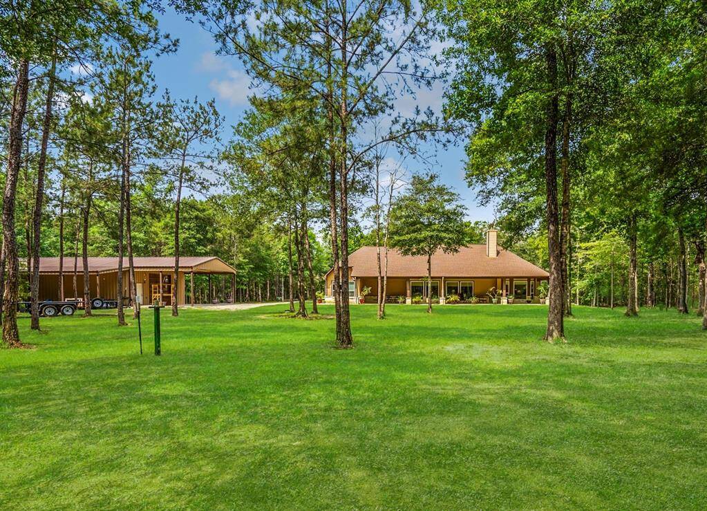 Tucked deep into the trees, this private 6-acre property offers space to spread out, breathe deep, and dream big. Whether you're hosting gatherings, working in the shop, or planning your next backyard adventure, there's room here for whatever life brings next.