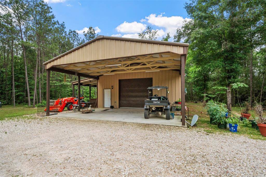 This impressive 1,200 sq ft workshop is ready for whatever you’ve got planned — from weekend projects and serious tools to extra storage or vehicle parking. With a concrete slab, wide roll-up doors, and covered areas on three sides, there’s room to work, build, and play.