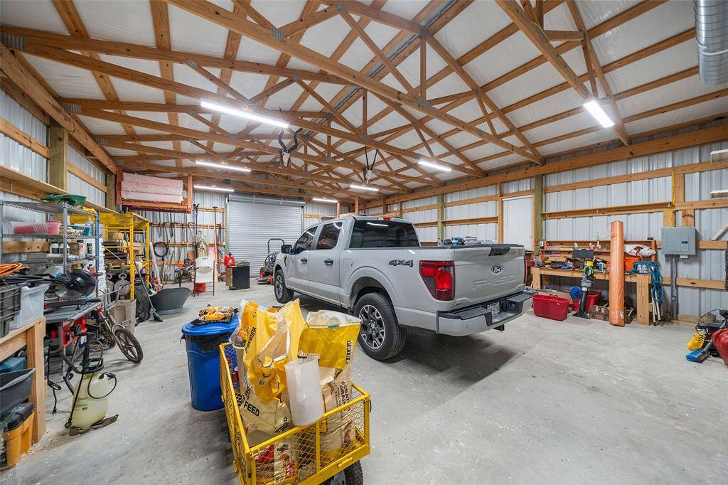 Step inside this 1,200 sq ft workshop and you’ll find space to spread out, organize, and get to work. With high ceilings, wide roll-up doors, built-in shelving, and room for vehicles or equipment, it’s the perfect setup for hobbies, storage, or serious projects.