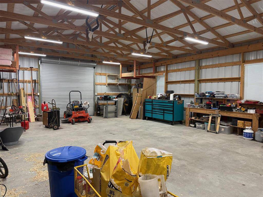 With tall rolling bay doors, bright overhead lighting, built-in shelving, and plenty of space for a tractor, multiple vehicles, or your favorite hobby setup, this 1,200 sq ft workshop is ready to work as hard as you do. Whether you're tackling weekend projects or storing essential gear, it's built to keep up.