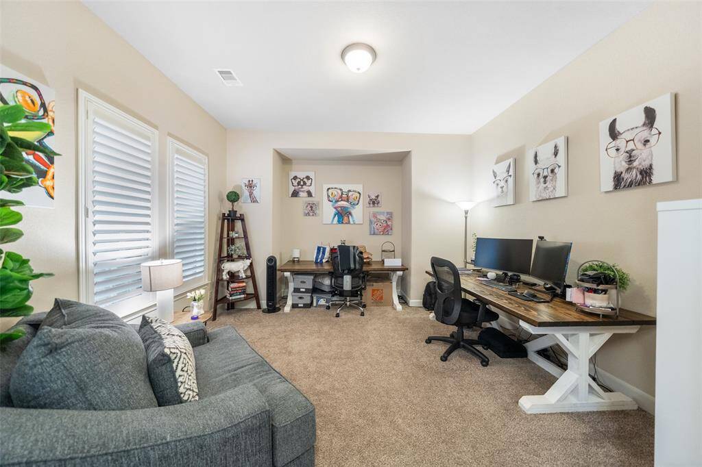 Whether you're working from home, exploring a creative hobby, or simply unwinding with a good book, this flexible space offers comfort and charm. Beautiful wood shuttered windows invite in natural light, while plush carpeting and a spacious layout make it ideal for work or relaxation.