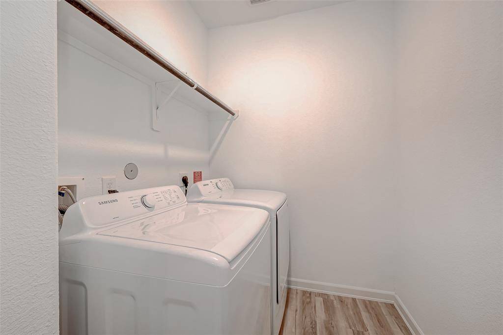 Spacious utility room with washer and dryer.