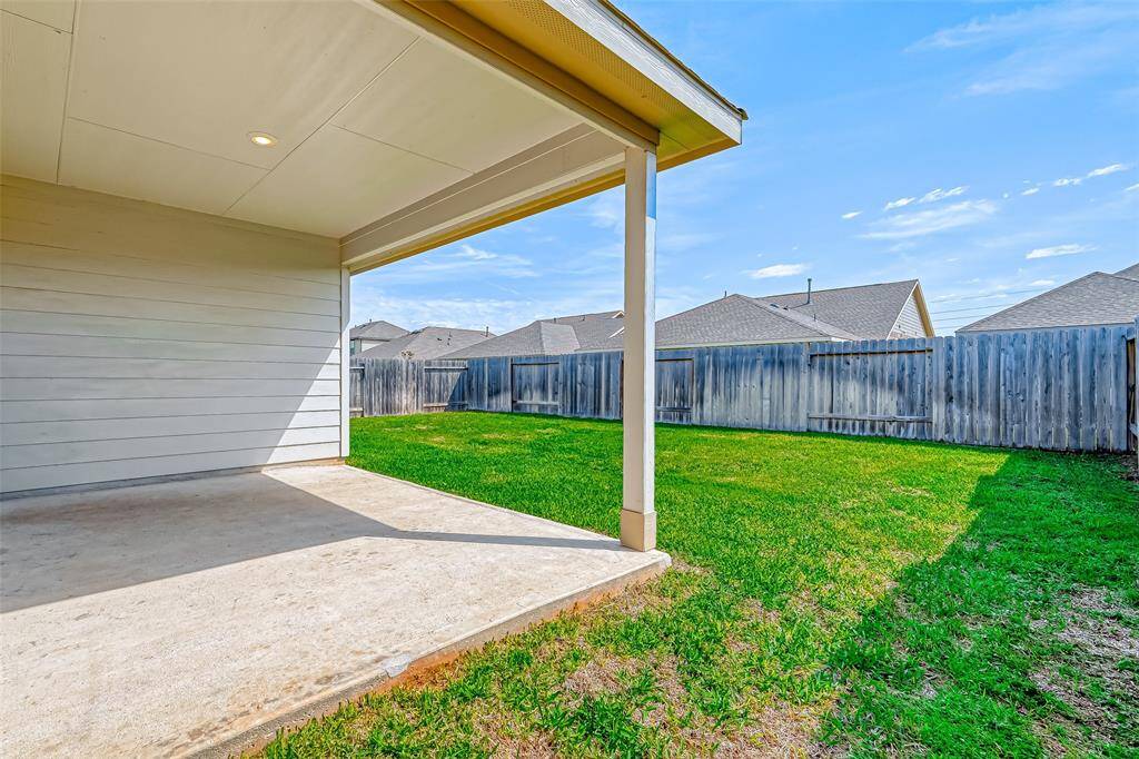 Great backyard space with covered patio.