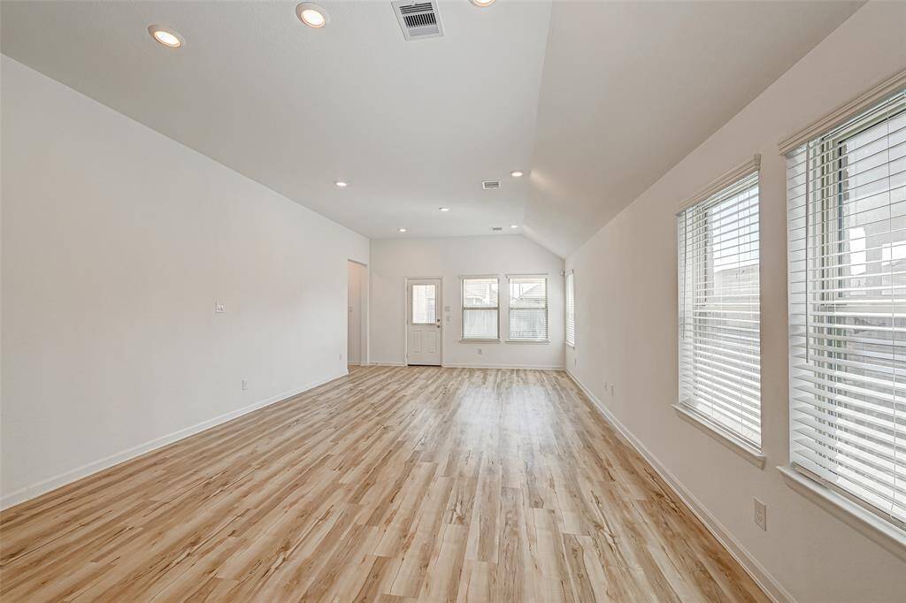 Open concept at its best. Kitchen, breakfast, and family room all in one area. So much natural light.
