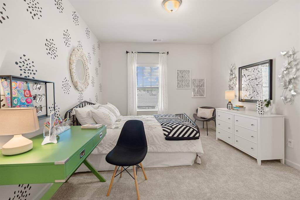 The James- Secondary Bedroom Upstairs. Home under construction. Sample floor plan photo used for illustrative purposes only. Upgrades, selections options, windows and colors may vary.