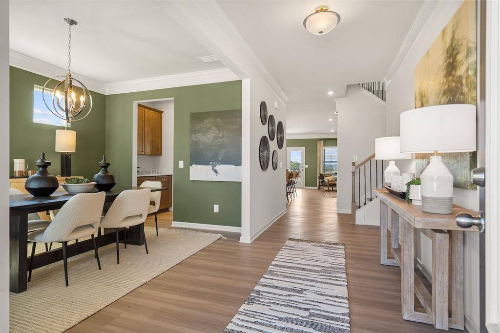 The James- Dining Room and Foyer. Home under construction. Sample floor plan photo used for illustrative purposes only. Upgrades, selections options, windows and colors may vary.