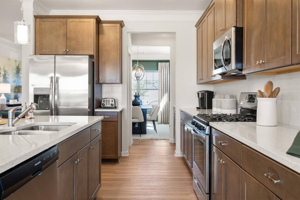 The James- Kitchen. Home under construction. Sample floor plan photo used for illustrative purposes only. Upgrades, selections options, windows and colors may vary.