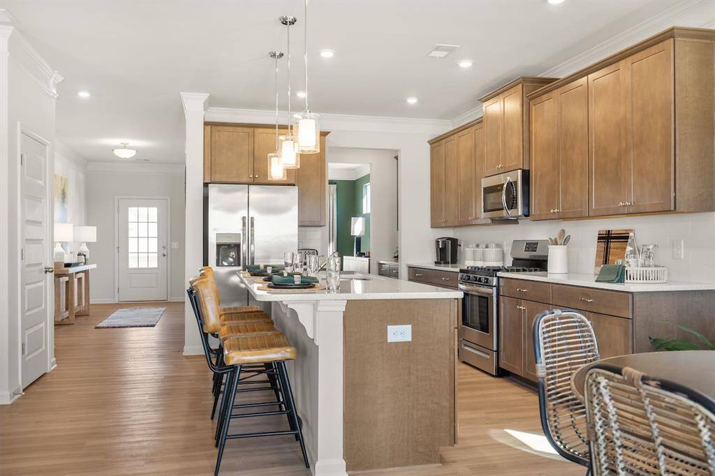 The James- Kitchen. Home under construction. Sample floor plan photo used for illustrative purposes only. Upgrades, selections options, windows and colors may vary.