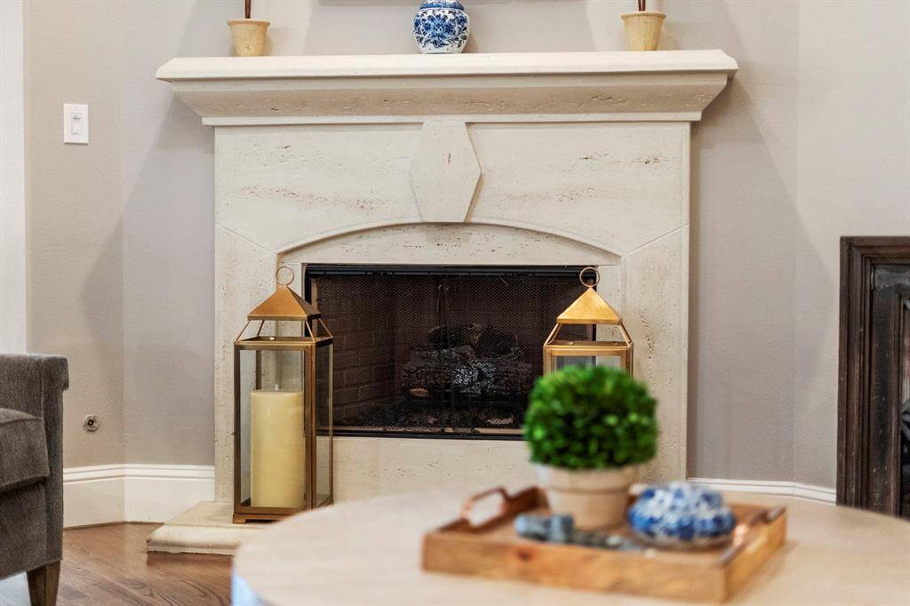 A gas log fireplace offers the warmth and ambiance of a traditional fire with the convenience of instant ignition, low maintenance, and consistent, clean-burning heat—perfect for cozy evenings.