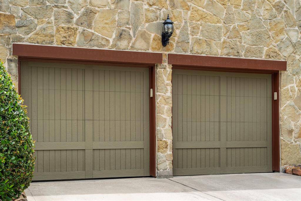 The two-car garage features separate garage doors, providing convenient access to each side while offering ample space for vehicles, storage, or a workshop.
