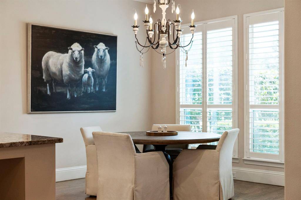 Soft natural light fills the breakfast area, highlighting its elegant design.