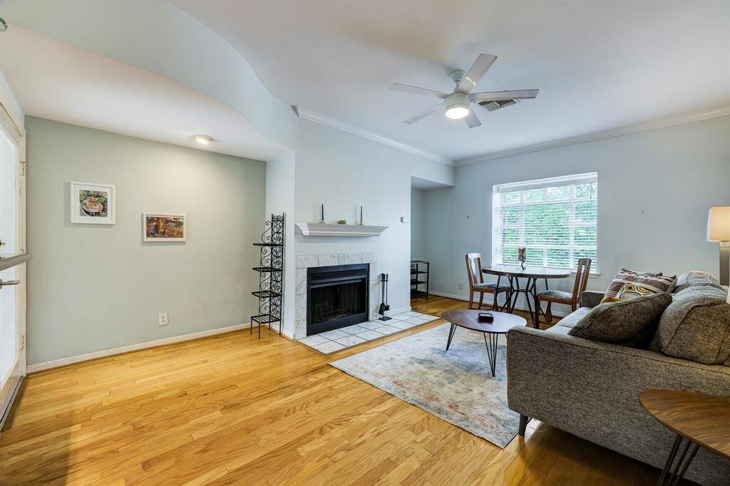 Spacious living room with real hardwood floors and working fireplace.