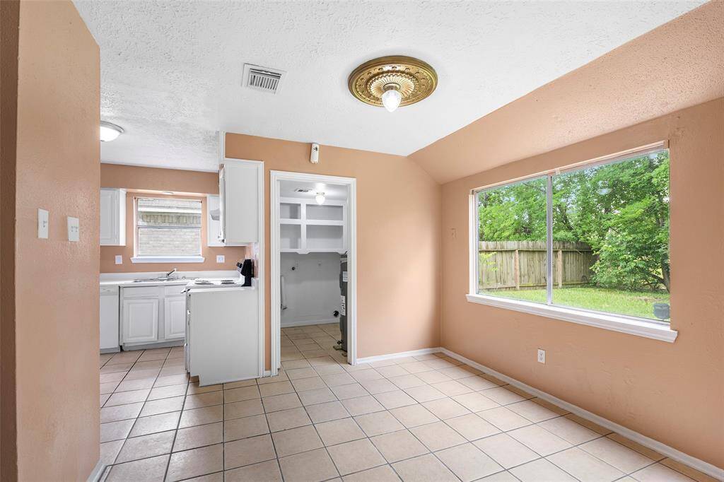 Off the kitchen is the breakfast nook with a large picture window with views of the backyard.  A great spot to enjoy that morning cup of coffee.  This area has direct access to the utility room for convenience and extra storage.