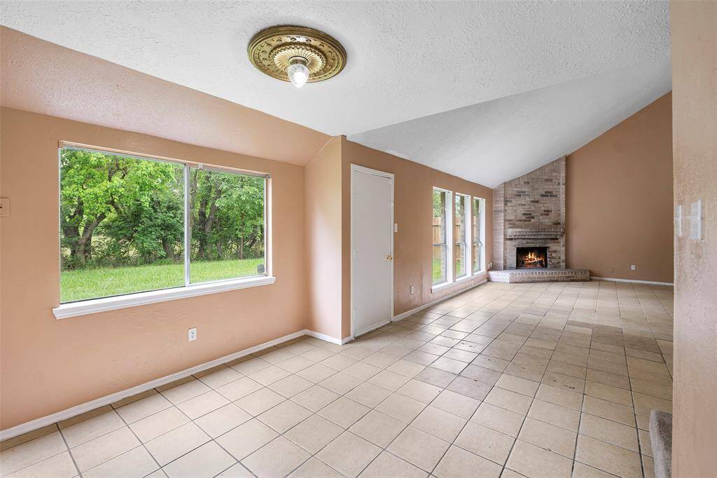 From the breakfast nook, you look into the family room with direct access to the backyard.