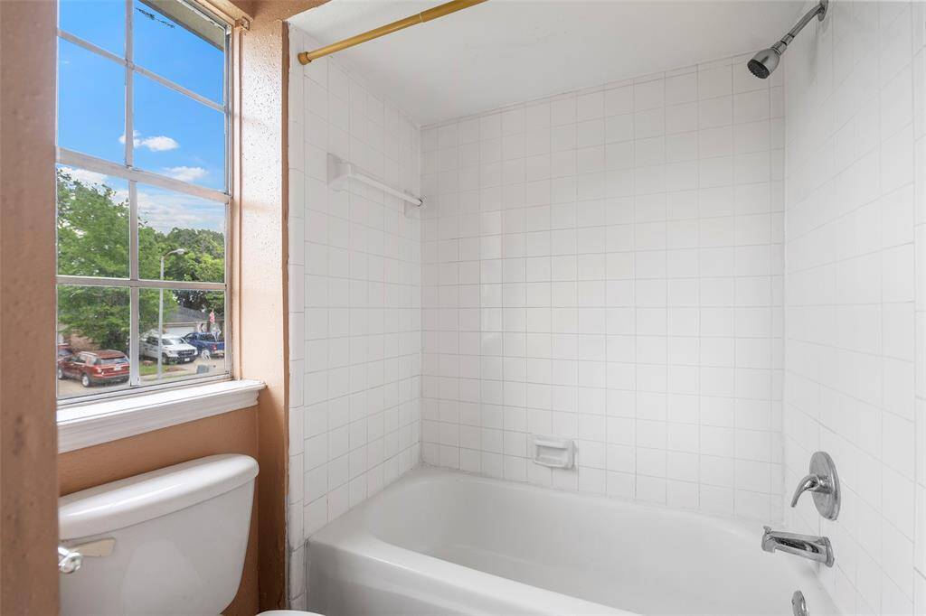 The shower is set apart from the main area offering privacy and seclusion
