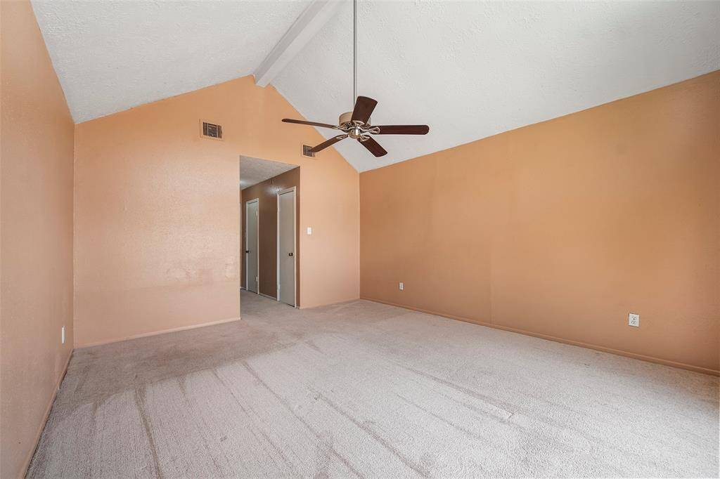 This room is spacious and cozy with the vaulted ceilings and soft carpet underfoot.  Double closets off the entry hallway offer ample space for all your storage needs.