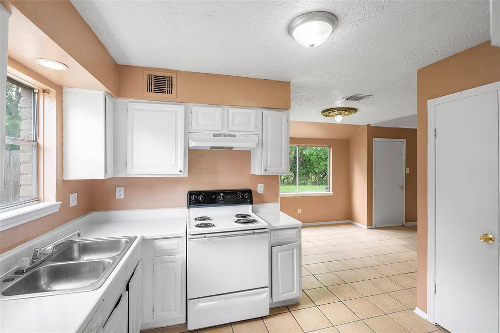 A generous amount of light flows through the kitchen creating a bright environment and cozy spot to prep meals.