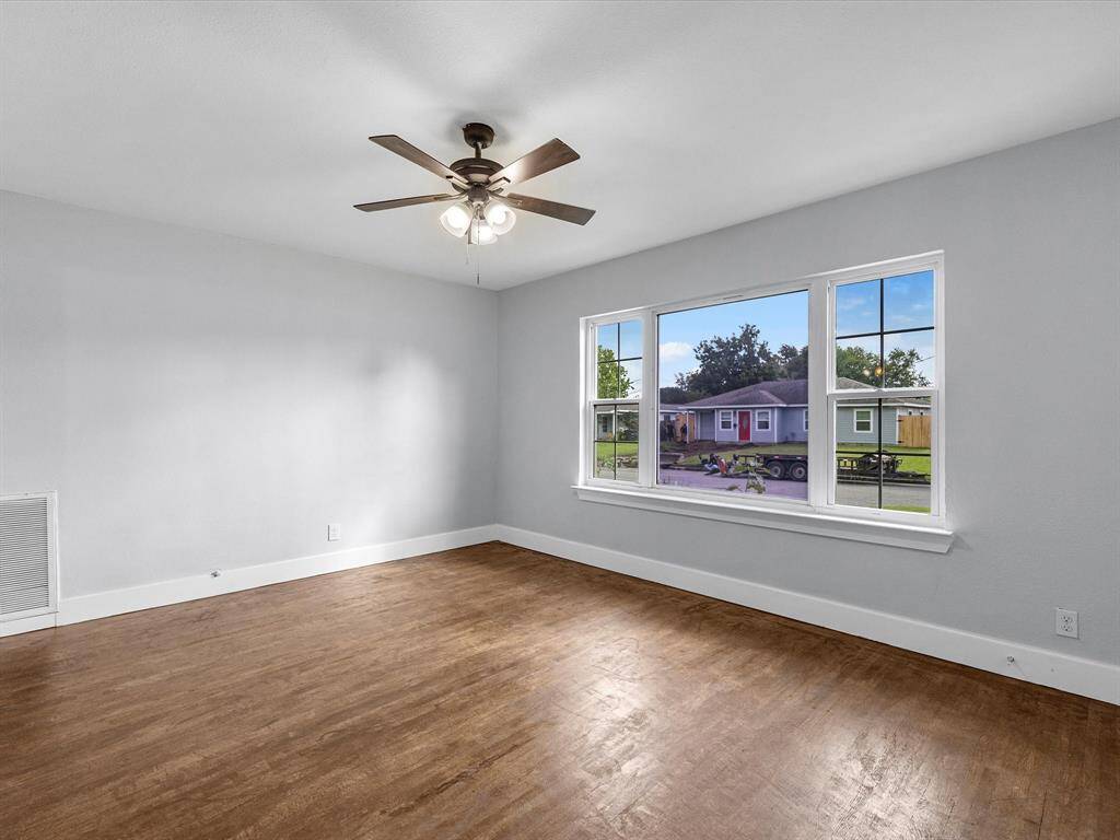 Front living room has beautiful sunlight coming in.