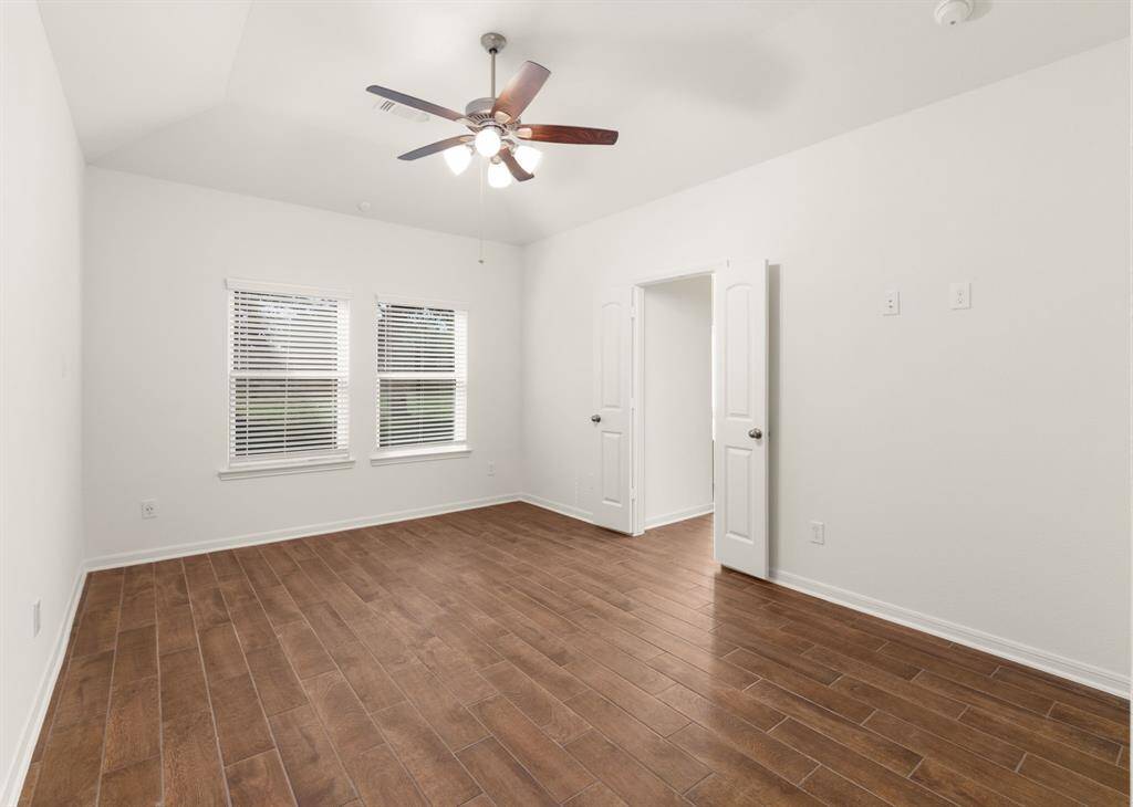 Spacious master bedroom with abundant natural light