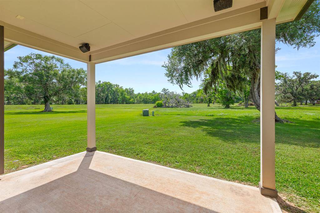 Enjoy outdoor living with a covered patio featuring surround sound