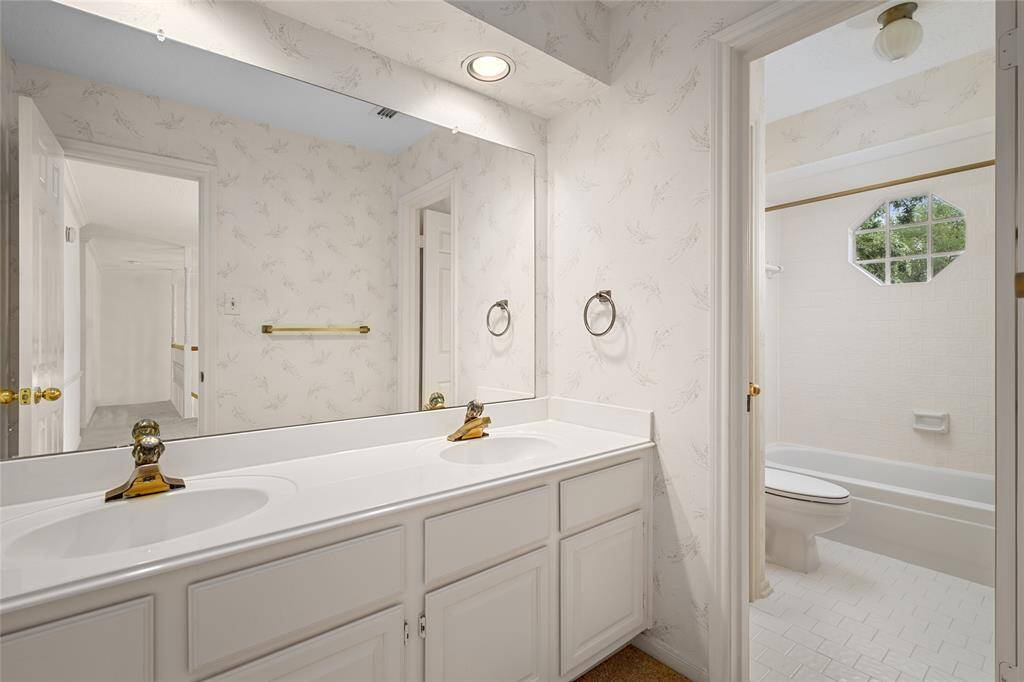 Bathroom #2 with double sinks and tub/shower combo