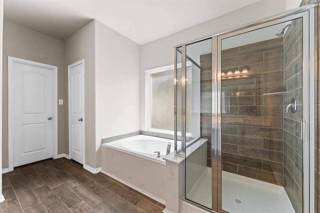 Primary Restroom with separate Tub/ Shower