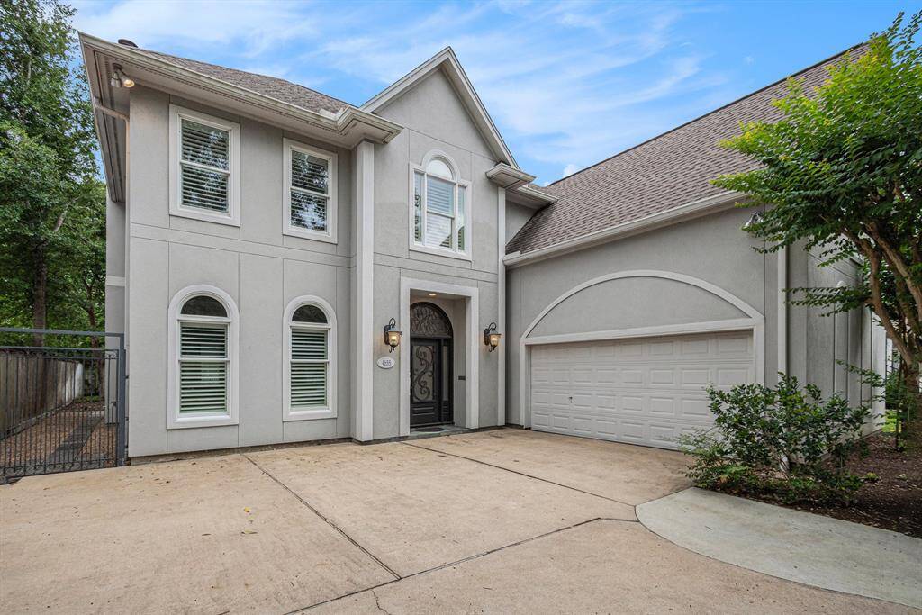 Front facade as seen from the driveway. This is a double wide driveway allowing for additional parking for guests.