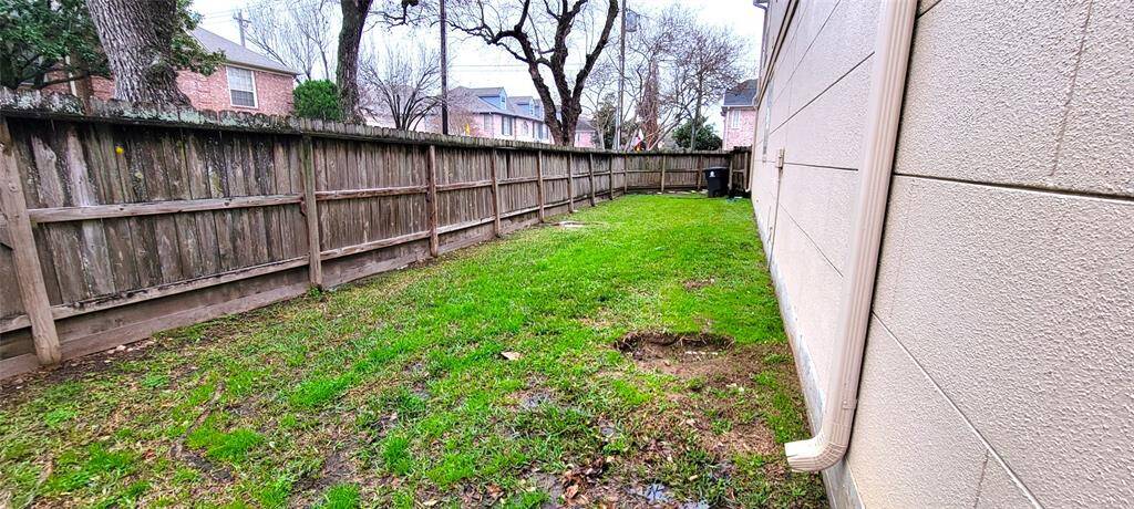 Large fenced sideyard off of back patio