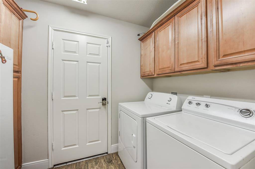 Great laundry with additional storage & freezer space
