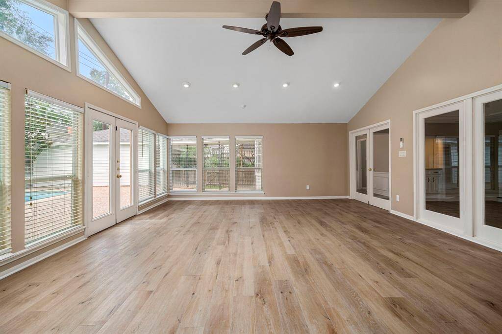 Another view of game room with beautiful recent flooring 4 months old, per seller.