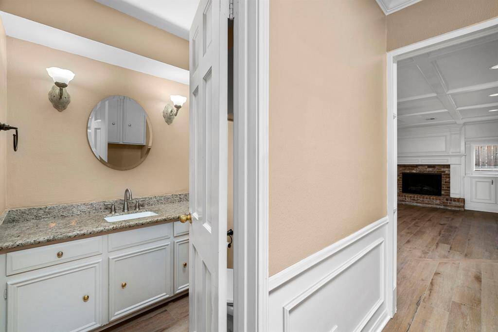 Powder bath has granite counters.