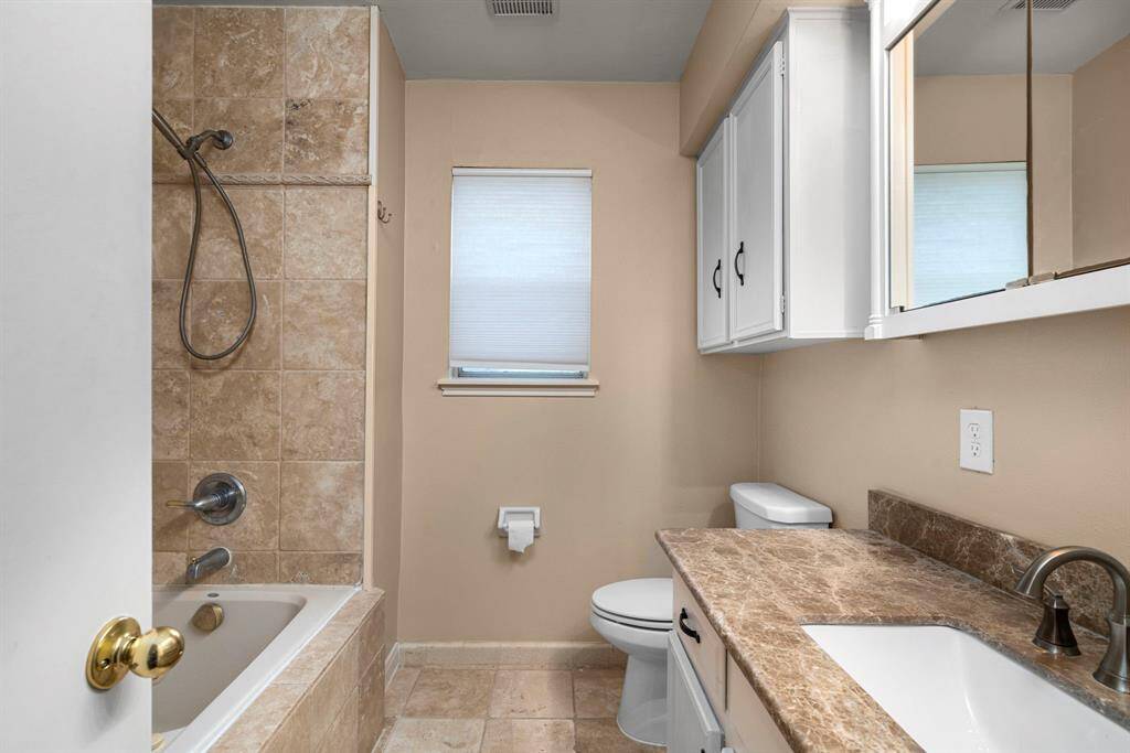 Master bath has combo tub and shower.