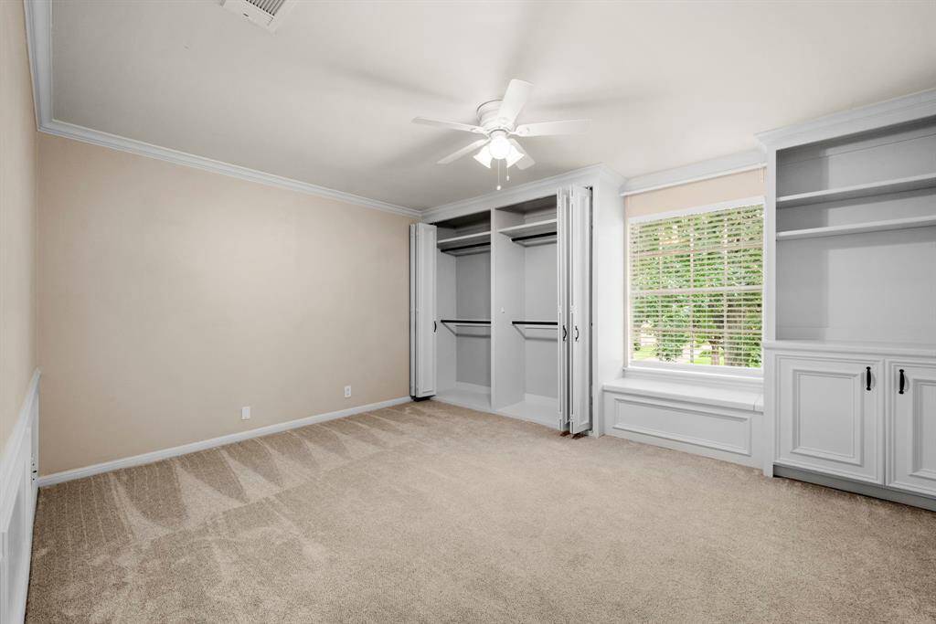 Bedroom 2 up #1 has newer carpet, neutral paint, crown molding.