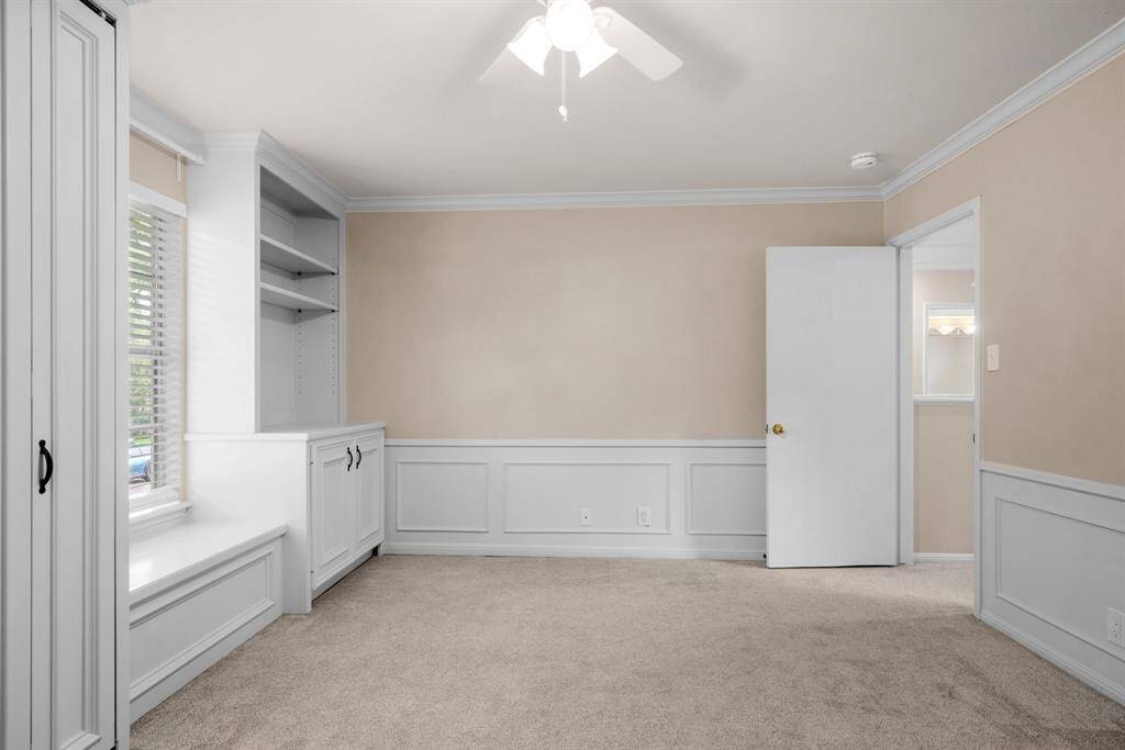 Secondary bedroom #2 up has newer carpet, neutral paint, crown molding.