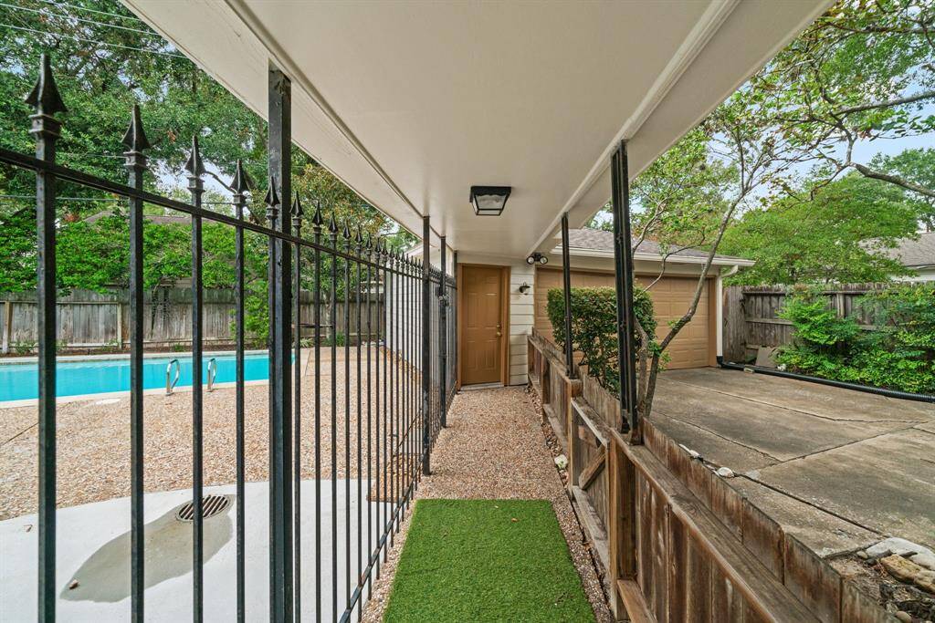Exit from back door to garage. Pool is well fenced for safety