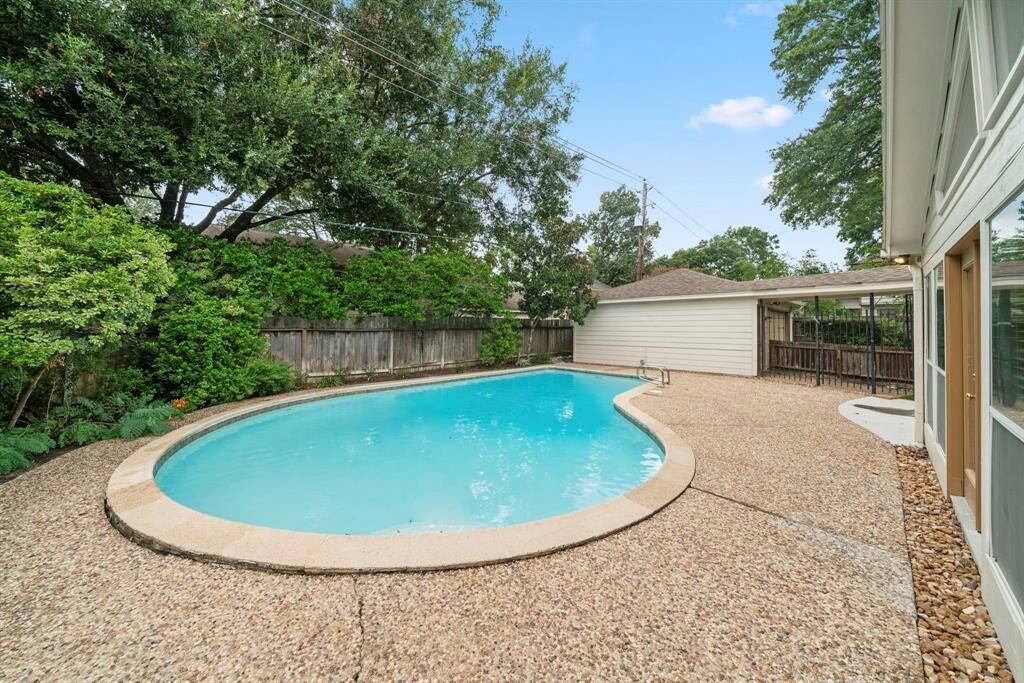 Sparkling pool with recent concrete patio and large decks for outdoor entertainment