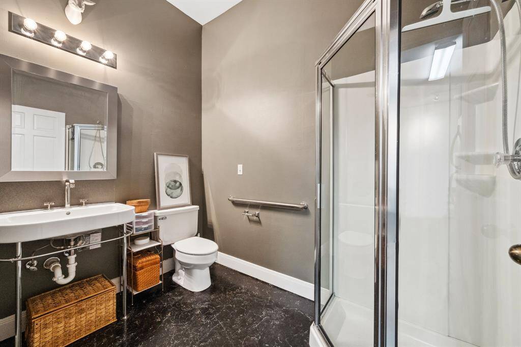 This spacious room with beautiful stained concrete floors offers endless possibilities. Whether you envision it as a downstairs living space, home office, workshop, or multi-generational living area, its size and versatility make it the perfect canvas to suit your needs.