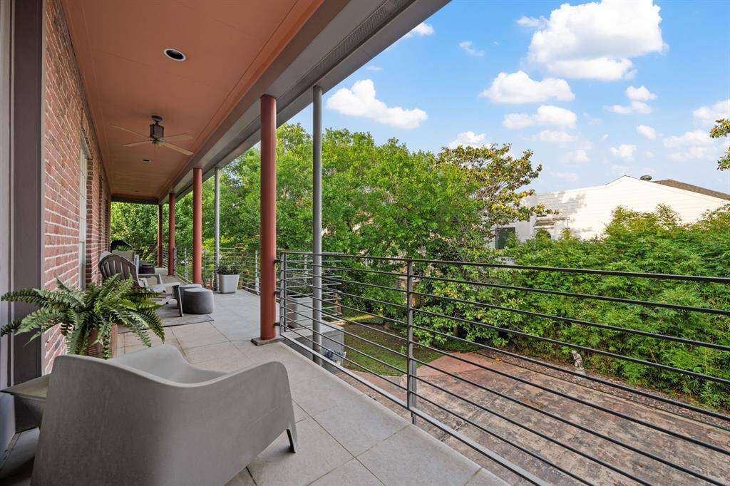 Covered carport accommodates two vehicles, with additional guest parking conveniently available nearby