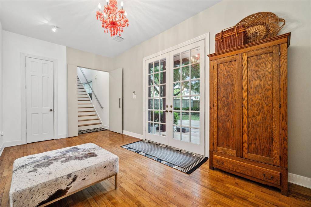 Step into a warm and welcoming space where natural light pours in, highlighting the elegant finishes and open feel of the entry. Perfect for greeting guests, this bright foyer sets the tone for the stylish living that awaits beyond.