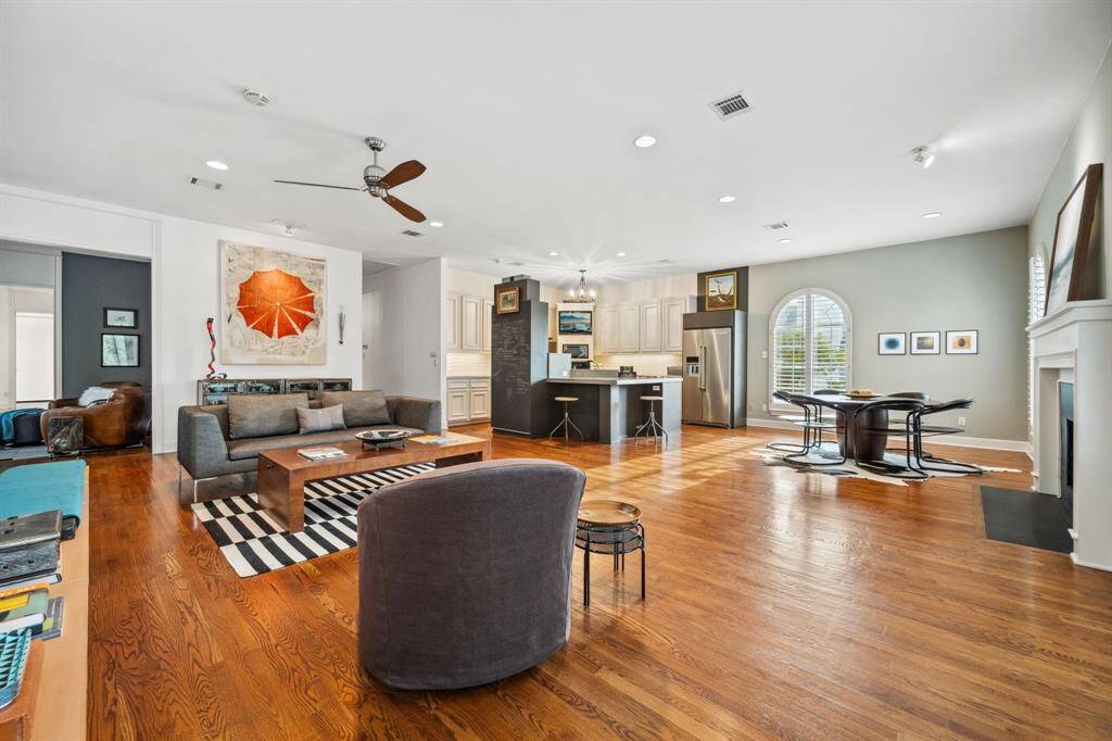This expansive upstairs living area features 10-foot ceilings, rich hardwood floors, and an abundance of natural light. Whether you're entertaining guests or enjoying a quiet evening with family, this inviting space offers the perfect blend of comfort and style.