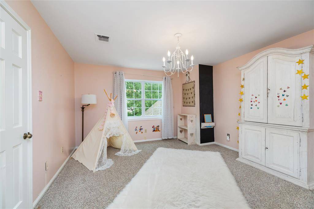 The secondary bedrooms are filled with beautiful details, offering plenty of space for play, rest, and relaxation. Whether for family or guests, these rooms provide a comfortable and inviting environment to enjoy life.