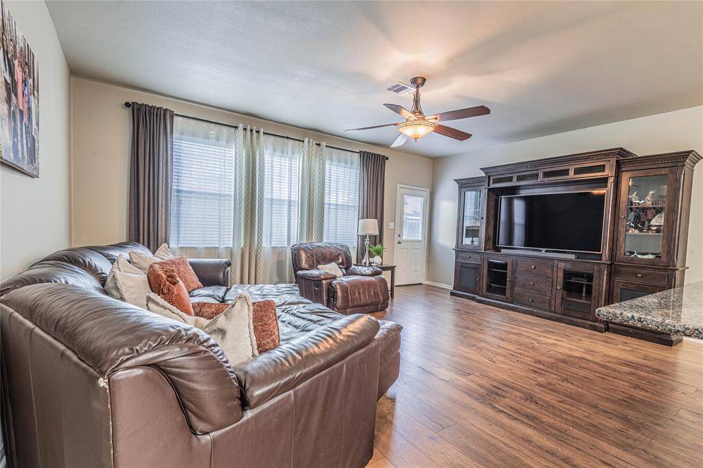 Hardwood look floors are immaculate.