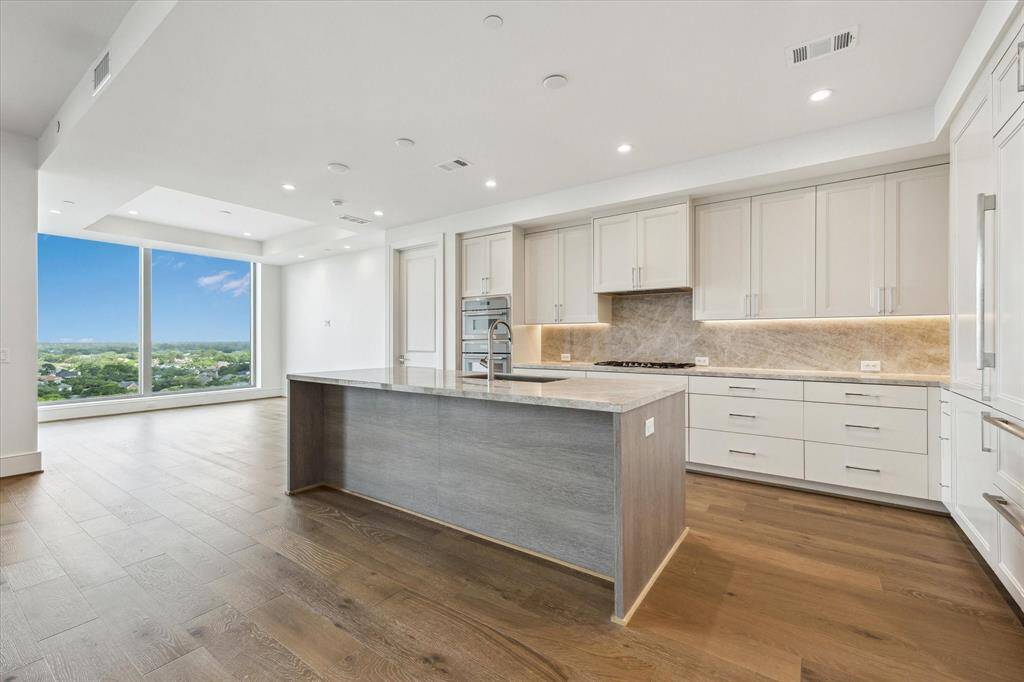 The state-of-the-art kitchen overlooks the formal dining room.