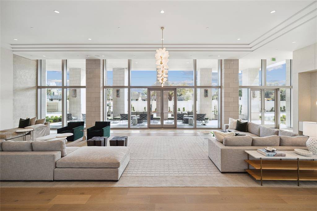 The impressive first-floor lounge/lobby area is great for visiting with neighbors and guests, reading a good book or enjoying easy access to the lovely landscaped terrace.