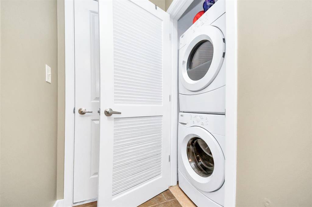 Convenient stacked laundry setup, maximizing space while making laundry day a breeze!