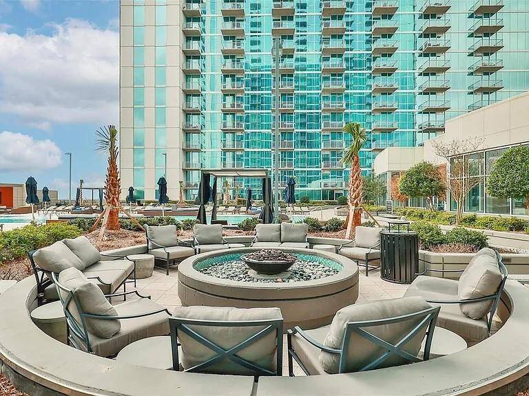Enjoy the cozy fireplace and ample seating, perfectly paired with stunning views just steps from the clubhouse!